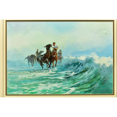 294 - JOHN HASKINS (BRITISH 1938) HORSES AND JOCKEYS EXERCISING SMALL BREAKING WAVES ON THE BEACH, signed ... 