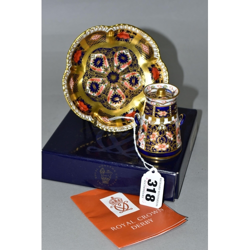 318 - TWO PIECES OF ROYAL CROWN DERBY GIFTWARES, comprising an Imari pattern 6299 miniature milk churn wit... 