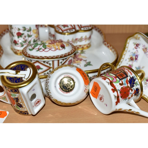 321 - A GROUP OF ROYAL CROWN DERBY, comprising a miniature garden roller, height 9.5cm, and watering can, ... 