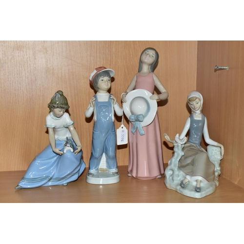 327 - THREE LLADRO FIGURES AND A NAO FIGURE, comprising model no 4660 Shepherdess with Dove, issued 1969-1... 