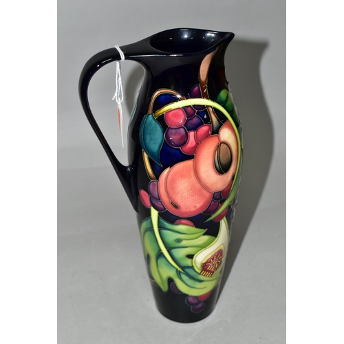 336 - A MOORCROFT POTTERY JUG WITH BOX, in the 'Queens Choice' pattern designed by Emma Bossons, of slende... 