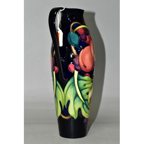 336 - A MOORCROFT POTTERY JUG WITH BOX, in the 'Queens Choice' pattern designed by Emma Bossons, of slende... 