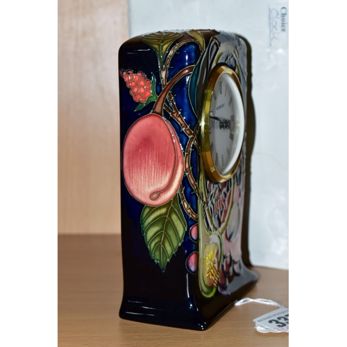 337 - A MOORCROFT POTTERY 'QUEENS CHOICE' PATTERN MANTEL CLOCK, designed by Emma Bossons, with impressed a... 