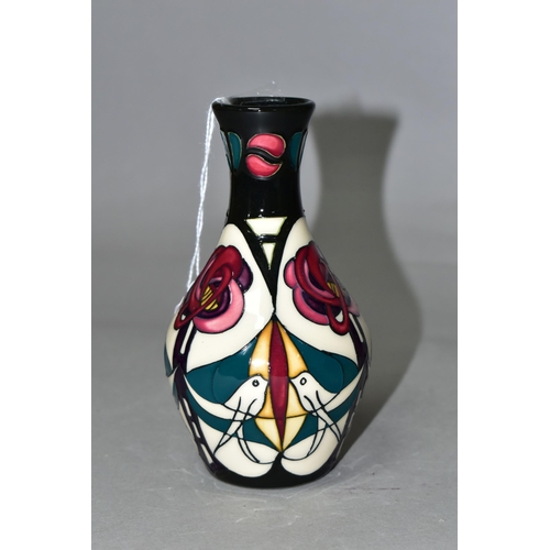 338 - A MOORCROFT POTTERY 'MELODY' PATTERN, bud vase with original box, designed by Sian Leaper, decorated... 