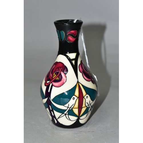 338 - A MOORCROFT POTTERY 'MELODY' PATTERN, bud vase with original box, designed by Sian Leaper, decorated... 