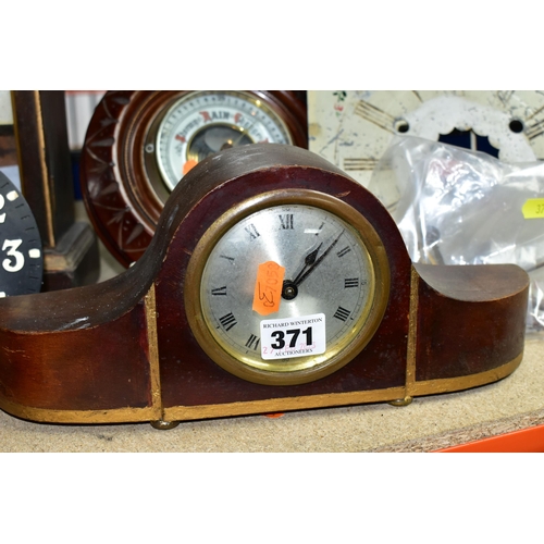 371 - A GROUP OF CLOCKS AND BAROMETERS, to include a cuckoo clock with weights, two mantel clocks, a woode... 