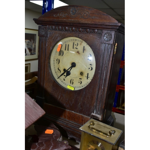 371 - A GROUP OF CLOCKS AND BAROMETERS, to include a cuckoo clock with weights, two mantel clocks, a woode... 