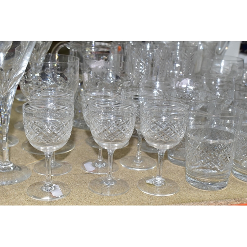 374 - A QUANTITY OF CUT CRYSTAL DRINKING GLASSES, more than sixty glasses to include nineteen faceted stem... 