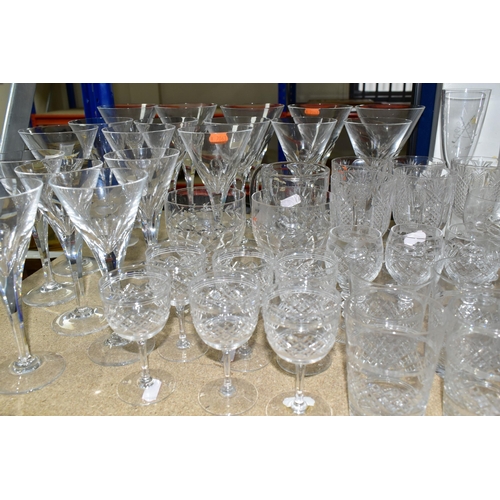 374 - A QUANTITY OF CUT CRYSTAL DRINKING GLASSES, more than sixty glasses to include nineteen faceted stem... 