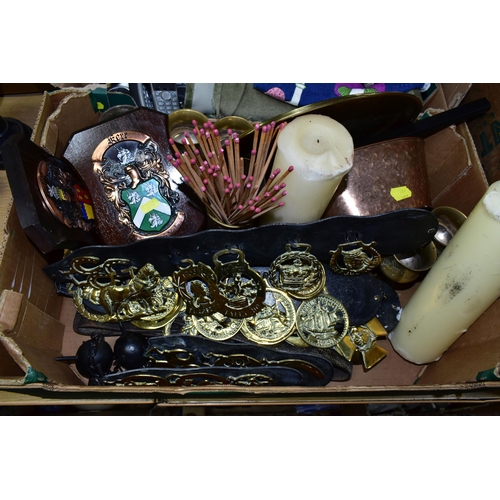 387 - TWO BOXES OF HOUSEHOLD SUNDRIES, to include ornamental horse brasses, brass ornaments, heraldic wall... 