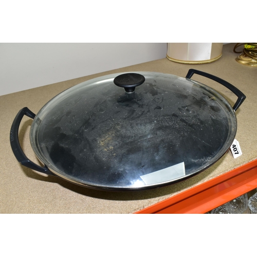 407 - A LE CREUSET CAST IRON WOK, with clear glass lid, impressed 36 on the base (1) (Condition Report: ap... 