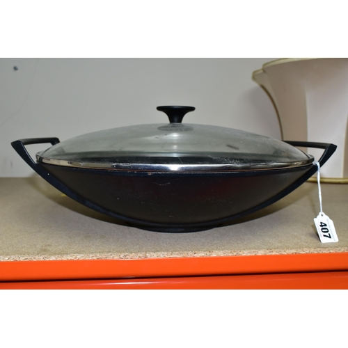 407 - A LE CREUSET CAST IRON WOK, with clear glass lid, impressed 36 on the base (1) (Condition Report: ap... 