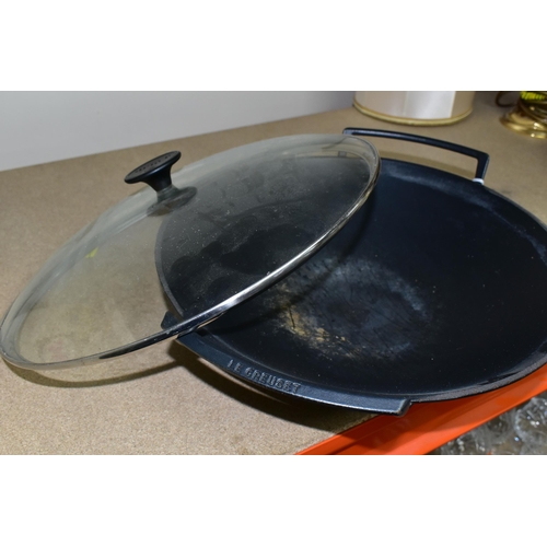 407 - A LE CREUSET CAST IRON WOK, with clear glass lid, impressed 36 on the base (1) (Condition Report: ap... 