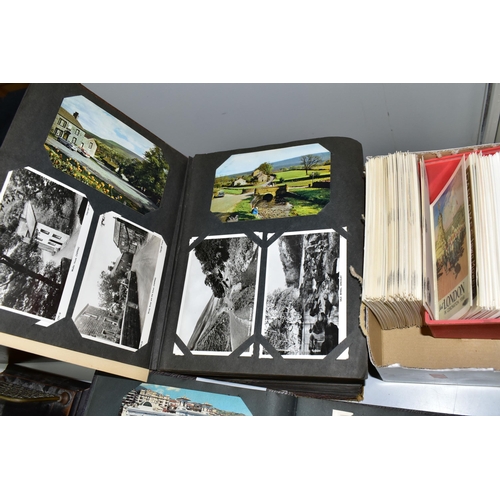 428 - POSTCARDS, Approximately 1075 Postcards in three albums and one box comprising topographical views, ... 