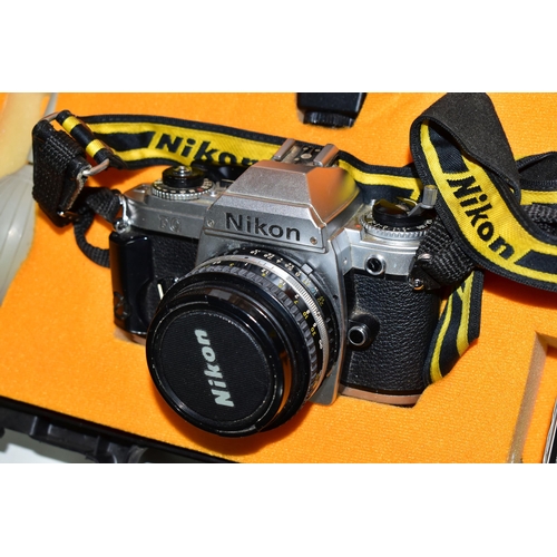 429 - A CASED NIKON FG CAMERA AND ACCESORIES, the camera fitted with a Nikon Series E f1.8 50mm lens, toge... 