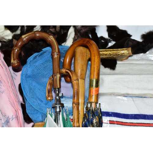 433 - TWO BOXES AND LOOSE LINENS, UMBRELLAS, AND A WALKING STICK, to include an antler handled walking sti... 