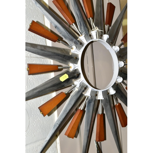 446 - FOUR MID-CENTURY SUNBURST WALL CLOCKS, and a teak and chrome sunburst clock frame (one ray tip sligh... 