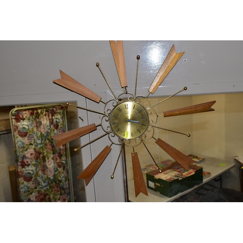 446 - FOUR MID-CENTURY SUNBURST WALL CLOCKS, and a teak and chrome sunburst clock frame (one ray tip sligh... 