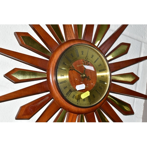 446 - FOUR MID-CENTURY SUNBURST WALL CLOCKS, and a teak and chrome sunburst clock frame (one ray tip sligh... 