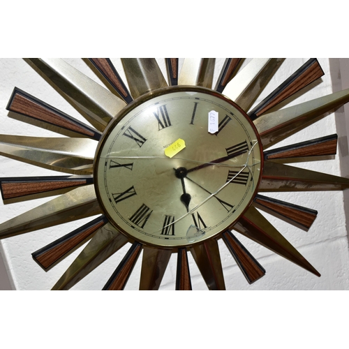 446 - FOUR MID-CENTURY SUNBURST WALL CLOCKS, and a teak and chrome sunburst clock frame (one ray tip sligh... 