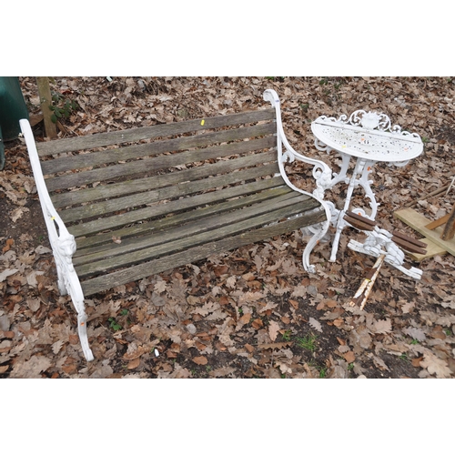 1006 - A SLATED GARDEN BENCH with cast aluminium ends along with a cast aluminium demilune garden table mea... 