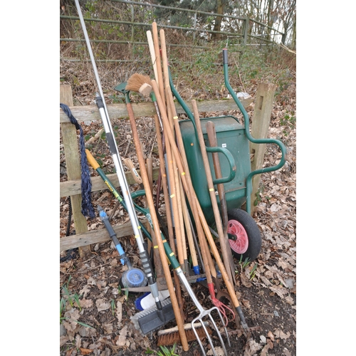 1007 - A COLLECTION OF GARDEN TOOLS to include spade, fork, brush, wheelbarrow etc