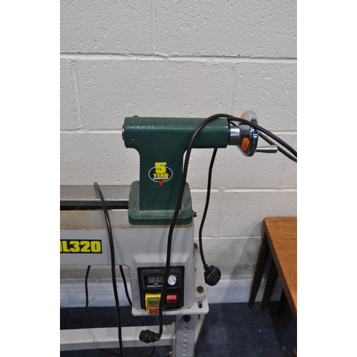 1082 - A RECORD DML320 WOODTURNING LATHE ON STAND with variable speed control and reverse function, total l... 