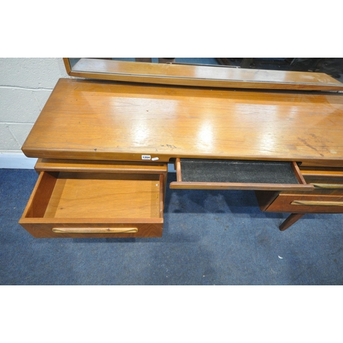 1204 - A MID CENTURY G PLAN FRESCO TEAK DRESSING TABLE, with a large rectangular mirror, a central slide, t... 