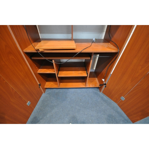 1235 - A LARGE COMPUTER CABINET, with two bifold doors, enclosing multipurpose fixtures, width 108cm x dept... 