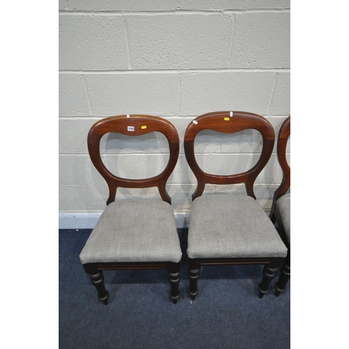 1240 - A SET OF FOUR VICTORIAN MAHOGANY BALLOON BACK CHAIRS, with grey upholstered seat pads, on turned and... 