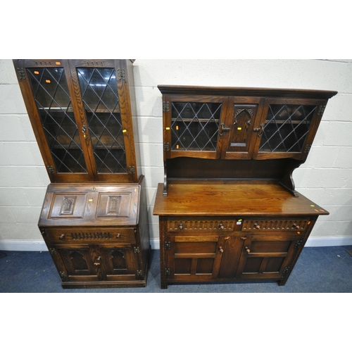 1255 - A 20TH CENTURY OAK DRESSER, the top with two lead glazed doors, base with two drawers over two cupbo... 