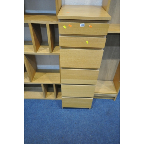 1266 - A SELECTION OF LIGHT OAK FURNITURE, to include a tall chest of seven drawers, with a mirrored hinged... 