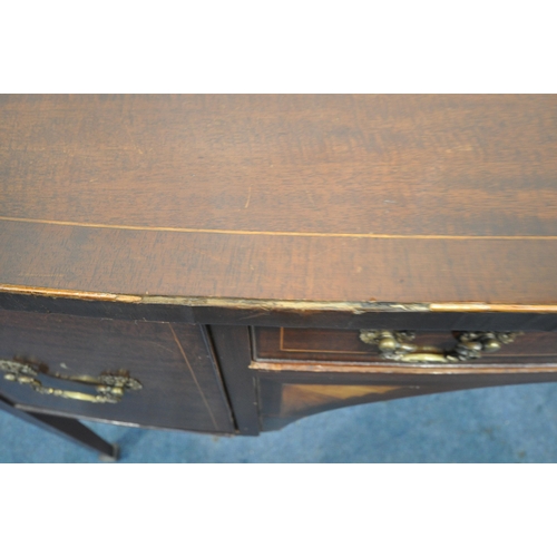 1278 - AN EDWARDIAN MAHOGANY AND INLAID BOW FRONT DESK, with three various drawers, on square tapering legs... 