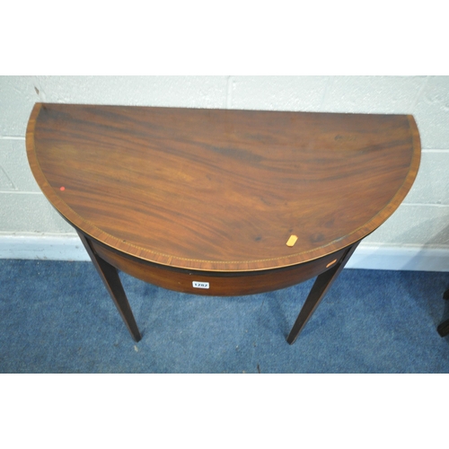 1282 - A GEORGIAN MAHOGANY AND CROSS BANDED FOLD OVER TEA TABLE, shell inlay to frieze, on square tapered l... 