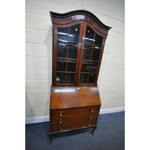 1293 - AN EARLY 20TH CENTURY MAHOGANY BUREAU BOOKCASE, the domed top with two glazed doors, enclosing three... 