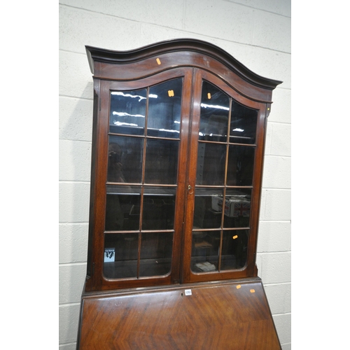 1293 - AN EARLY 20TH CENTURY MAHOGANY BUREAU BOOKCASE, the domed top with two glazed doors, enclosing three... 