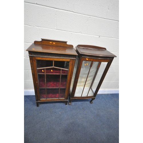 1296 - A 20TH CENTURY OAK SINGLE DOOR DISPLAY CABINET, with a raised back, the glazed door enclosing two sh... 