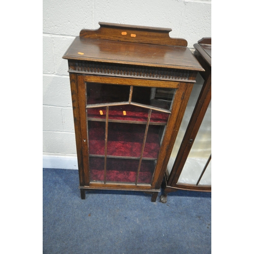 1296 - A 20TH CENTURY OAK SINGLE DOOR DISPLAY CABINET, with a raised back, the glazed door enclosing two sh... 