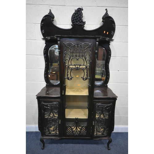 1309 - A LATE 19TH CENTURY MAHOGANY DISPLAY CABINET, with an arrangement of glazed doors, with foliate scro... 