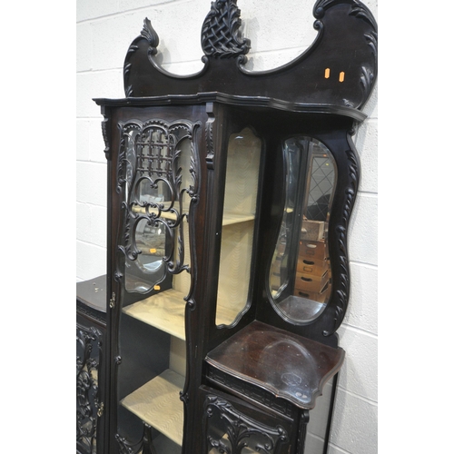 1309 - A LATE 19TH CENTURY MAHOGANY DISPLAY CABINET, with an arrangement of glazed doors, with foliate scro... 