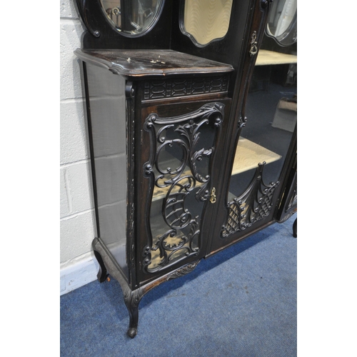 1309 - A LATE 19TH CENTURY MAHOGANY DISPLAY CABINET, with an arrangement of glazed doors, with foliate scro... 