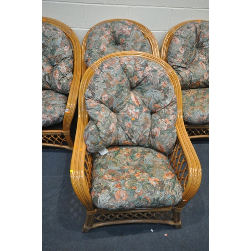 1320 - FOUR WICKER CONSERVATORY ARMCHAIRS, with floral upholstered cushions (4)