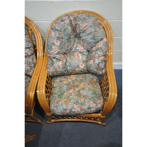 1320 - FOUR WICKER CONSERVATORY ARMCHAIRS, with floral upholstered cushions (4)