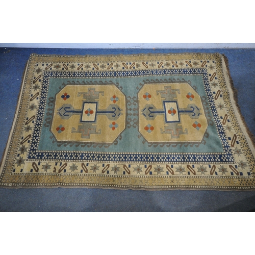 1326 - A PERSIAN MILAS RUG, cream and gold, and central red field, 190cm x 120cm (discolouration) and a Per... 