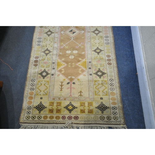 1327 - A TURKISH MILAS RUG, 220cm x 122cm (dirty and discoloured) a late 20th century woollen rug 126cm x 9... 