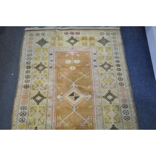 1327 - A TURKISH MILAS RUG, 220cm x 122cm (dirty and discoloured) a late 20th century woollen rug 126cm x 9... 