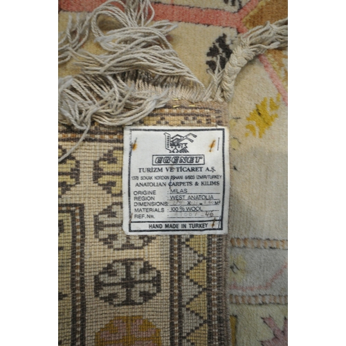 1327 - A TURKISH MILAS RUG, 220cm x 122cm (dirty and discoloured) a late 20th century woollen rug 126cm x 9... 