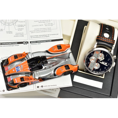 107 - A RAIDILLON 'CONQUEST ENDURANCE' DAY DATE WRISTWATCH WITH PRESENTATION BOX, the watch with black dia... 