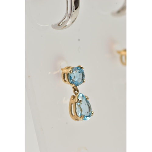 12 - TWO PAIRS OF GEM SET EARRINGS, the first a pair of curved drop earrings each set with a circular cut... 