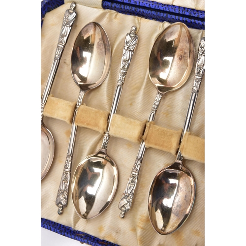 151 - AN INCOMPLETE SET OF GEORGE V APOSTLE TOP TEASPOONS, ANOTHER SILVER TEASPOON AND A SILVER NAPKIN RIN... 